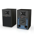 Black JBL 4305P 5.25" active bookshelf monitors, one with a black grille, the other revealing a blue baffle.